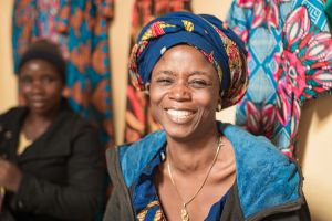 African woman smiling with head wrap