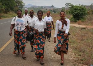 Group of African women walking with matching skirts