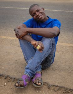 African man sitting and smiling