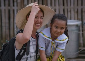 White Female photographer with young Asian girl