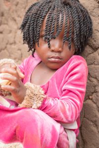 Little African girl sitting down