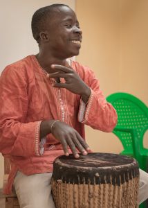 African man playing traditional drums