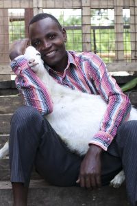 African man holding goat